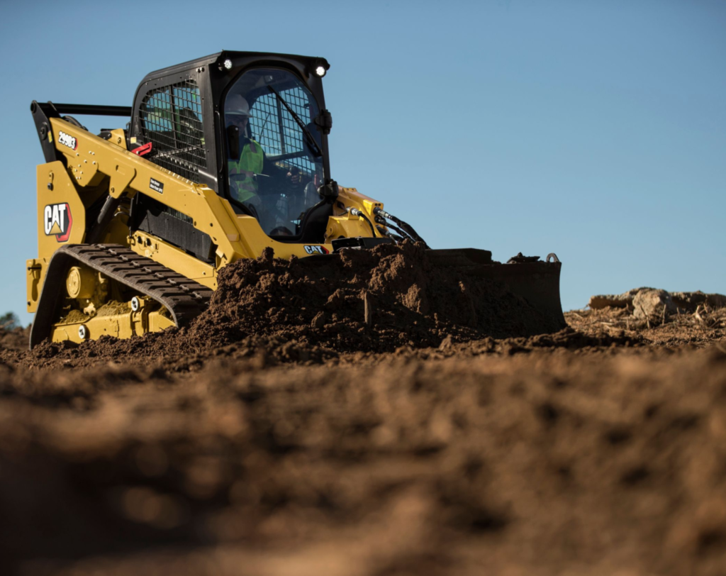 Yellow grader used by JKT Outdoor Services Ltd. for precise road grading in Parkland County, Alberta, Canada.